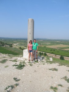 My Wife and I standing in front of the column